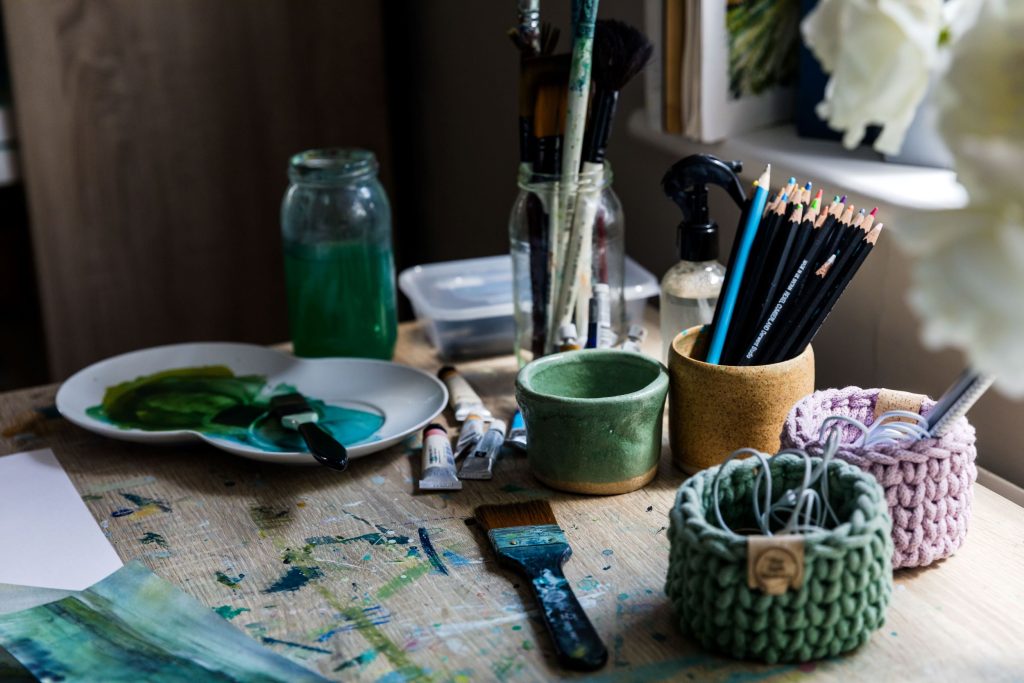 Charlotte Riley, British Contemporary Artist. Landscape image of painting table & equipment